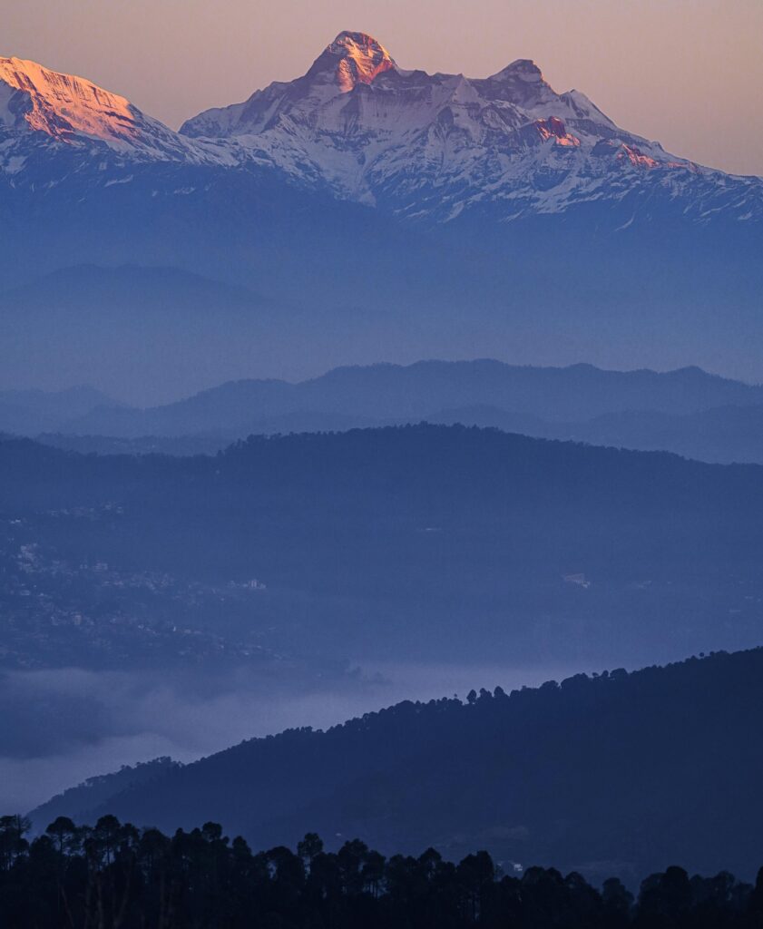 Captivating view of Mukteshwar mountains at sunset, showcasing natural beauty.