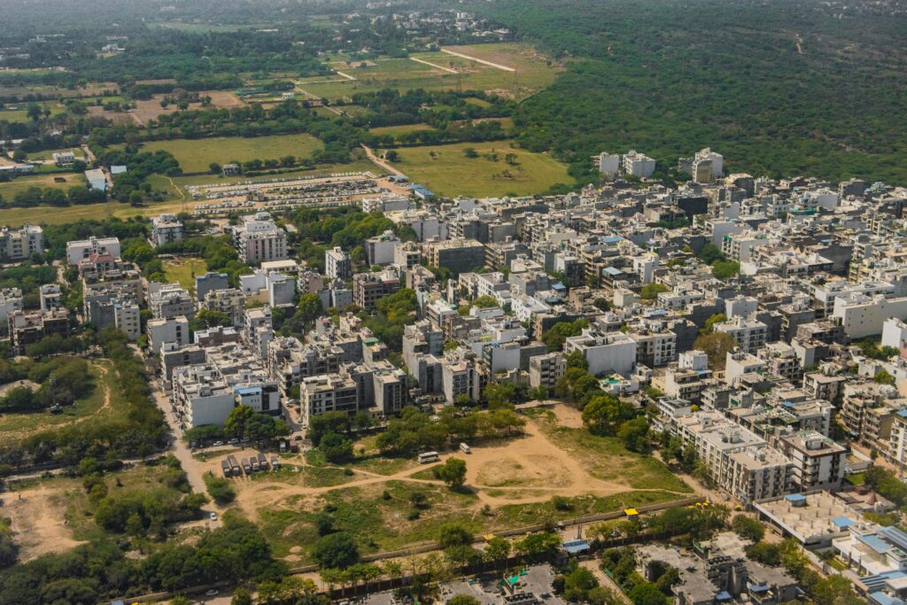 Stunning aerial view of Gurugram, India's vibrant urban landscape and green surroundings.